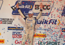 Jake Hill celebrates with his trophy on the podium